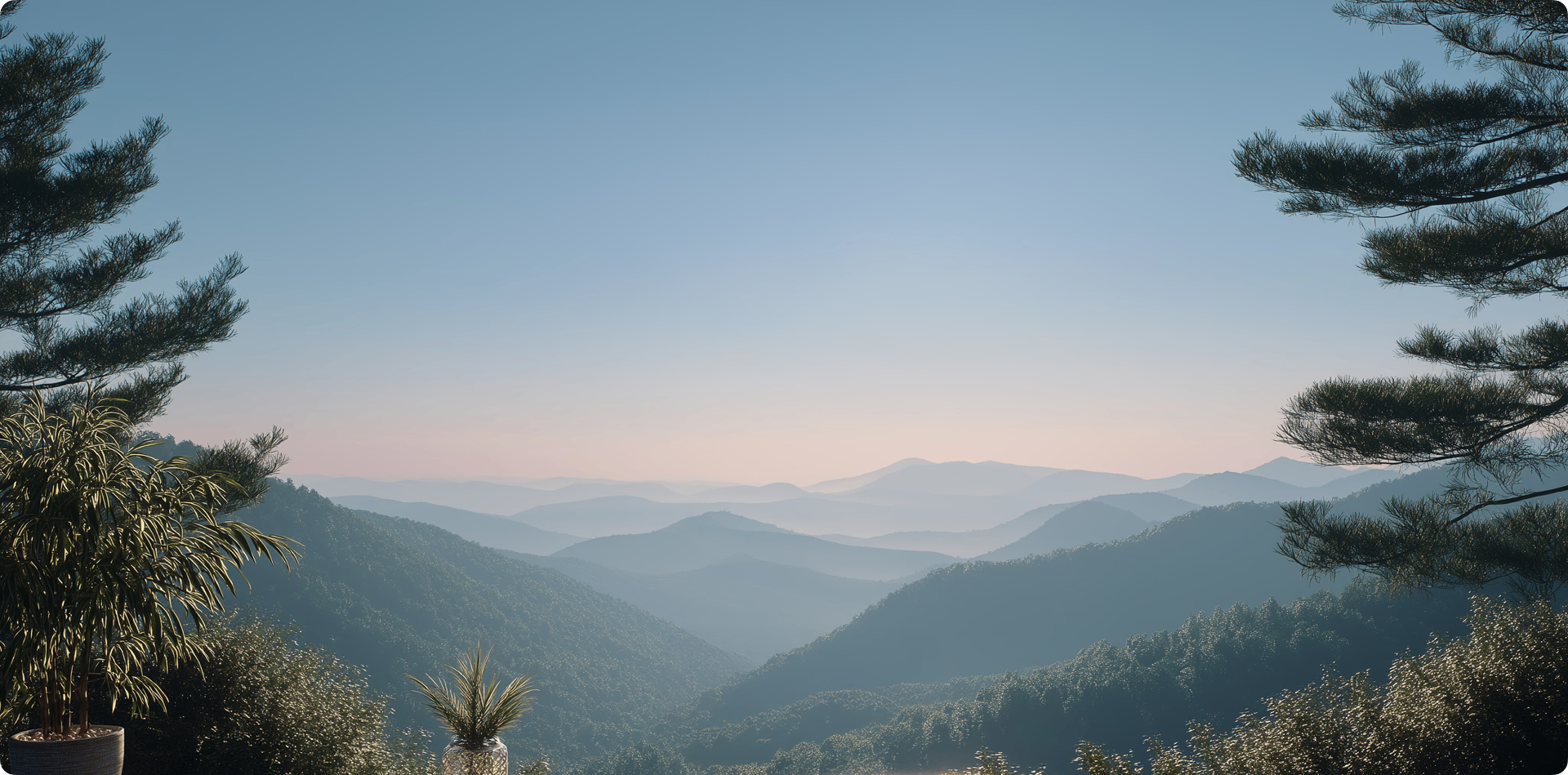 Misty twin-peak mountains at dusk